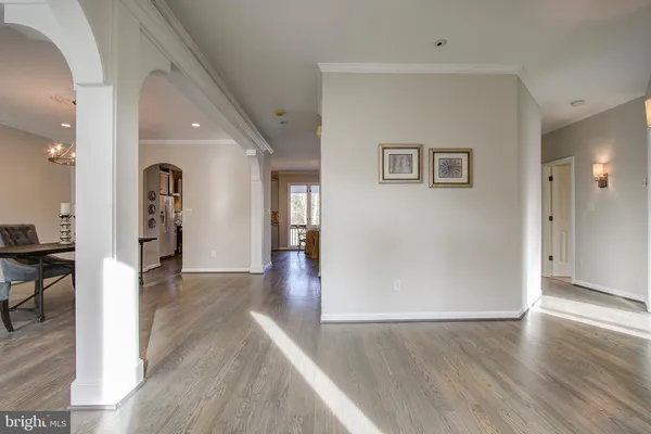 wooden floor in a hall with an entryway door