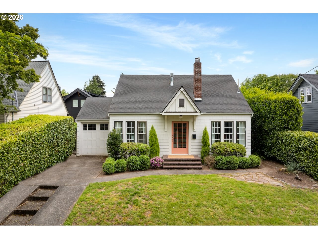 7416 Southeast 36th Avenue Portland, OR 97202 - Photo 1 of 45 a front view of a house with a yard