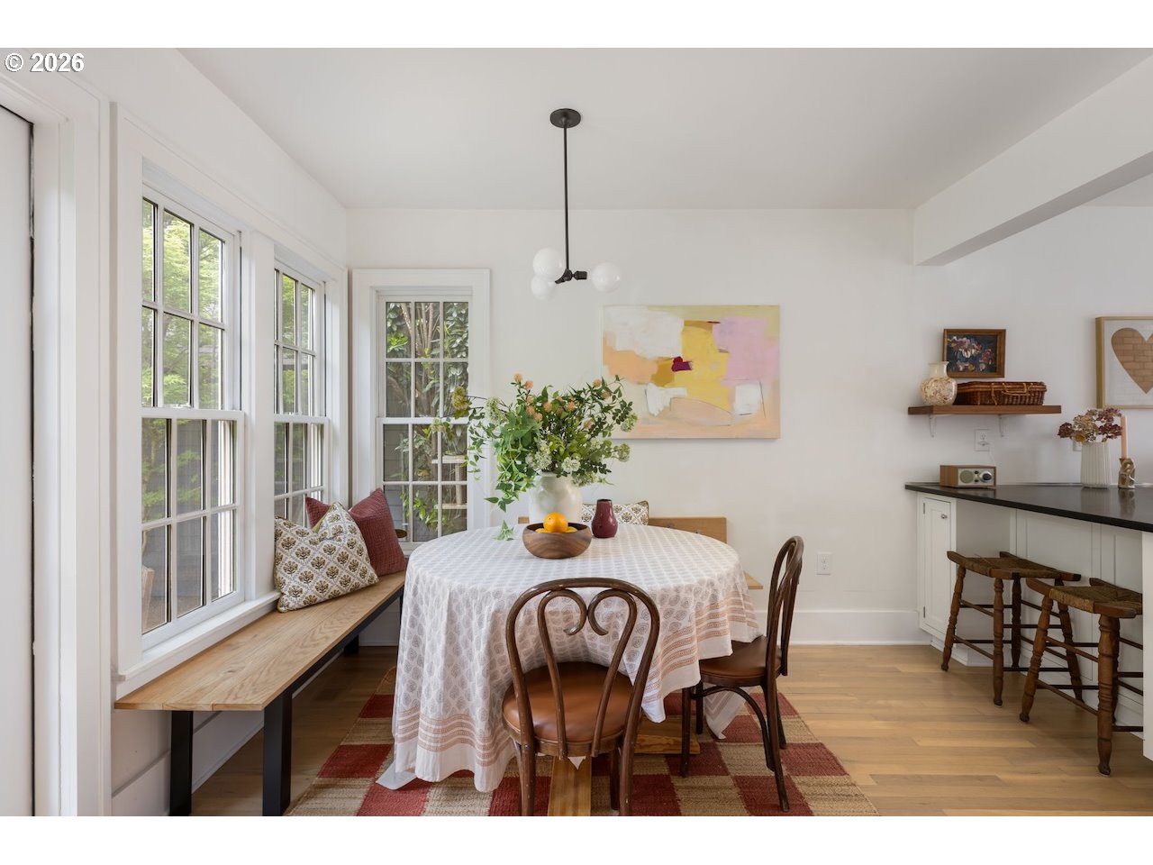 7416 Southeast 36th Avenue Portland, OR 97202 - Photo 17 of 45 a dining room with furniture a chandelier and wooden floor
