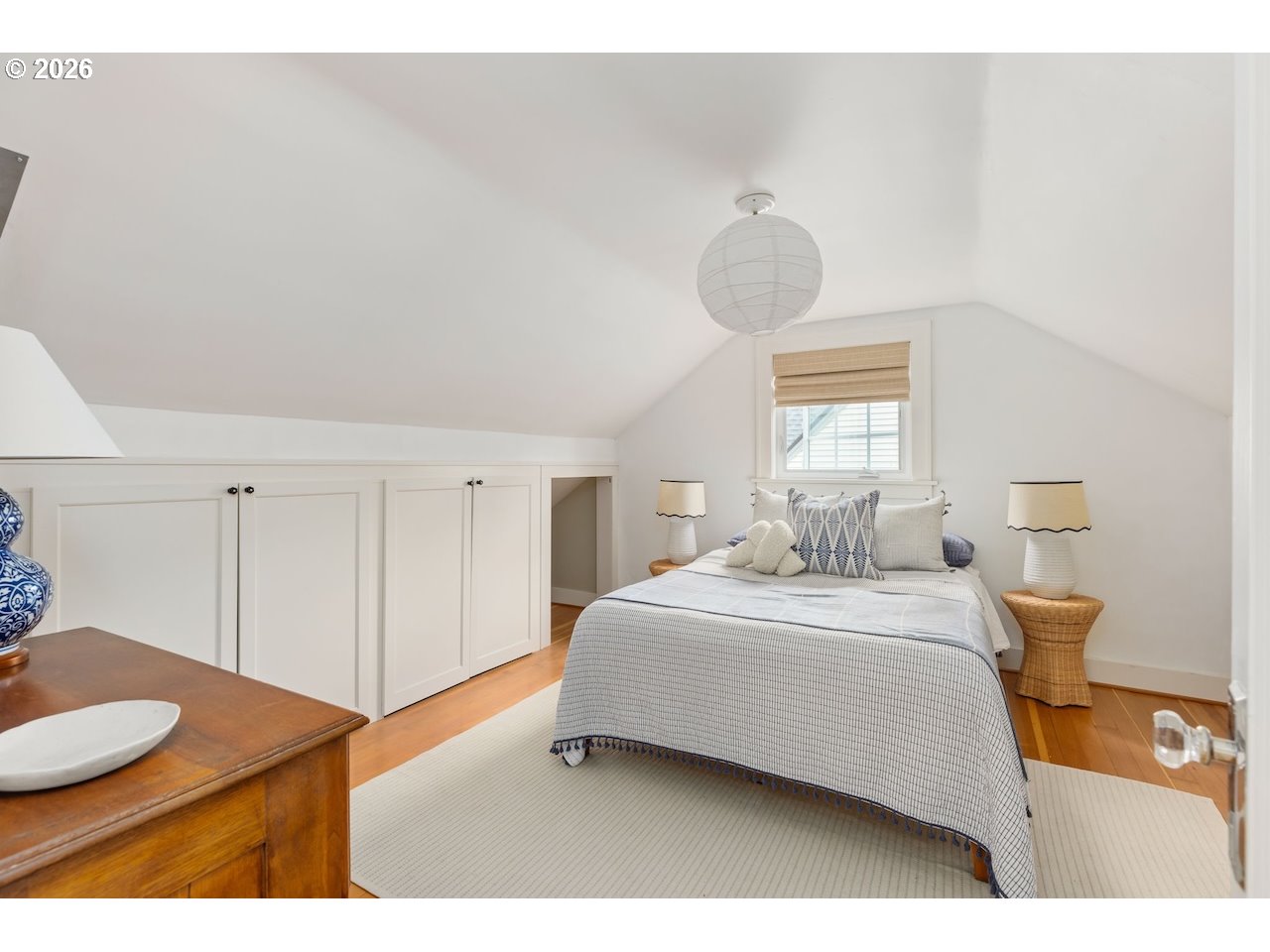 7416 Southeast 36th Avenue Portland, OR 97202 - Photo 21 of 45 a bedroom with a bed and a chandelier