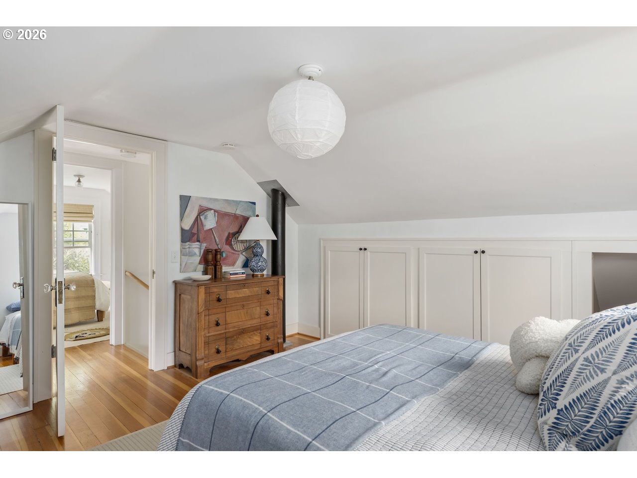 7416 Southeast 36th Avenue Portland, OR 97202 - Photo 22 of 45 a bedroom with a bed and a dresser