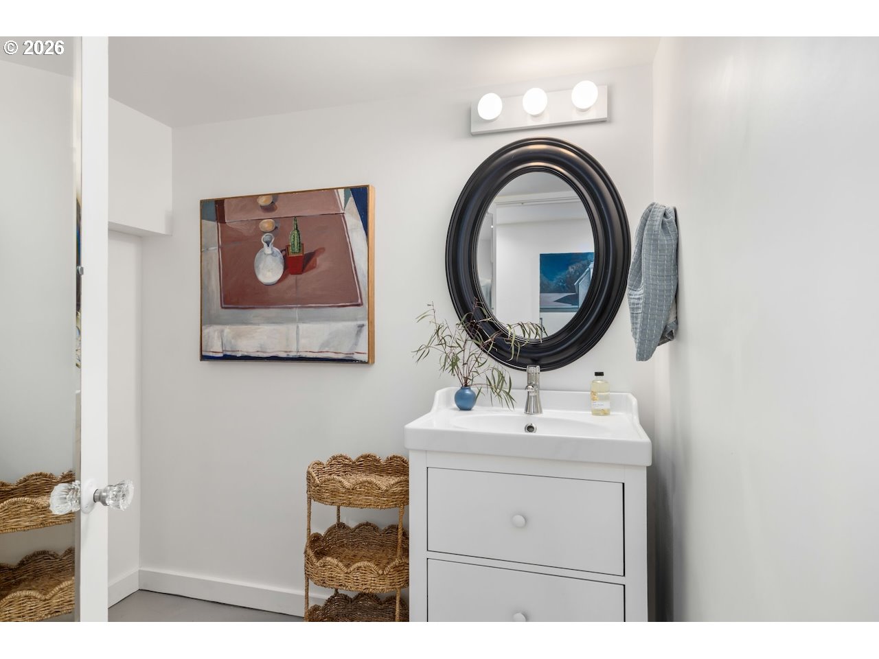 7416 Southeast 36th Avenue Portland, OR 97202 - Photo 33 of 45 a bathroom with a sink a mirror and a fan