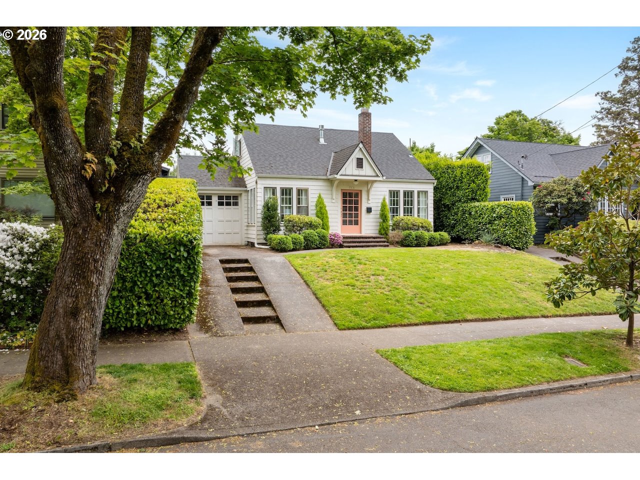 7416 Southeast 36th Avenue Portland, OR 97202 - Photo 43 of 45 a front view of a house with a yard