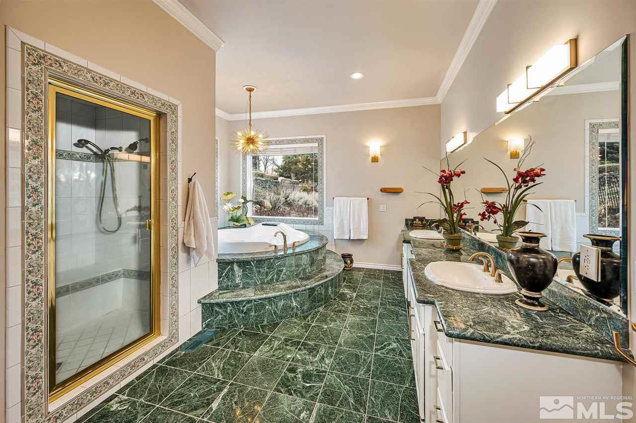 1585 Star Way Reno, NV 89511 - Photo 13 of 25 a bathroom with a double vanity sink mirror and shower