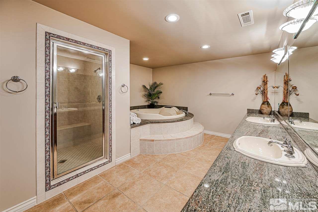 1585 Star Way Reno, NV 89511 - Photo 18 of 25 a bathroom with a sink a toilet and shower