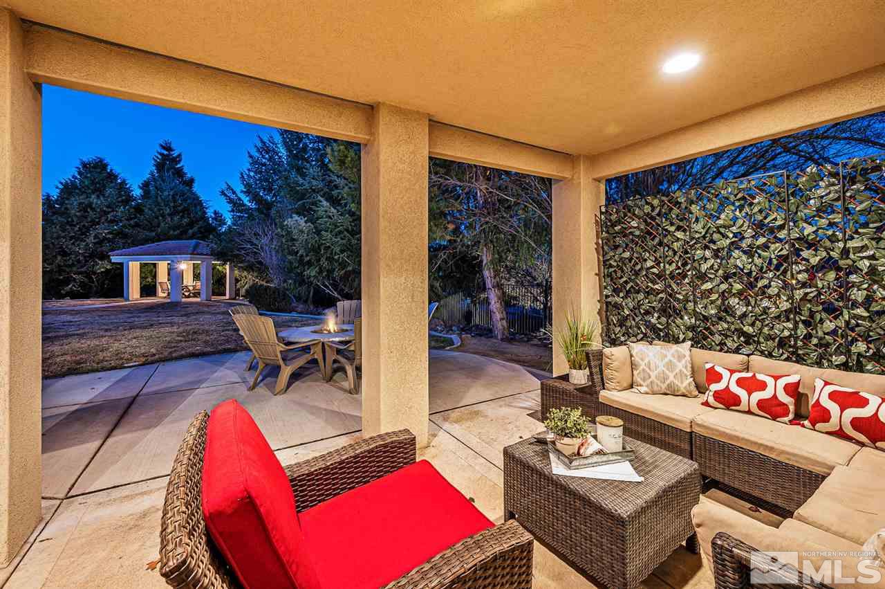 1585 Star Way Reno, NV 89511 - Photo 21 of 25 a living room with furniture and a floor to ceiling window