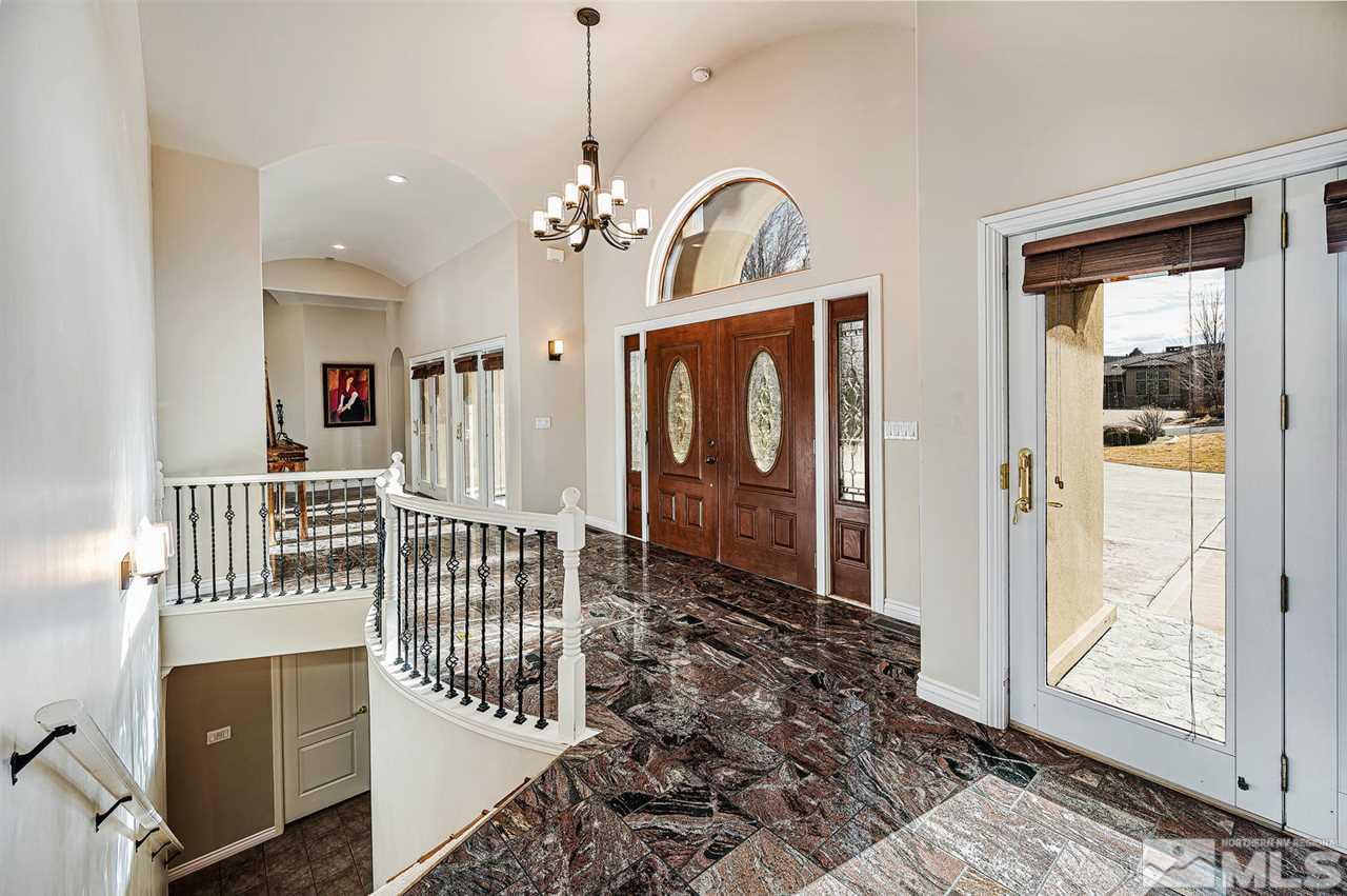 1585 Star Way Reno, NV 89511 - Photo 4 of 25 a view of a hallway with wooden floor and windows
