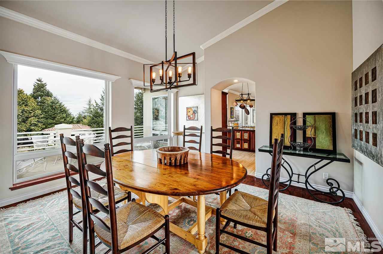 1585 Star Way Reno, NV 89511 - Photo 5 of 25 a dining room with furniture a chandelier and wooden floor