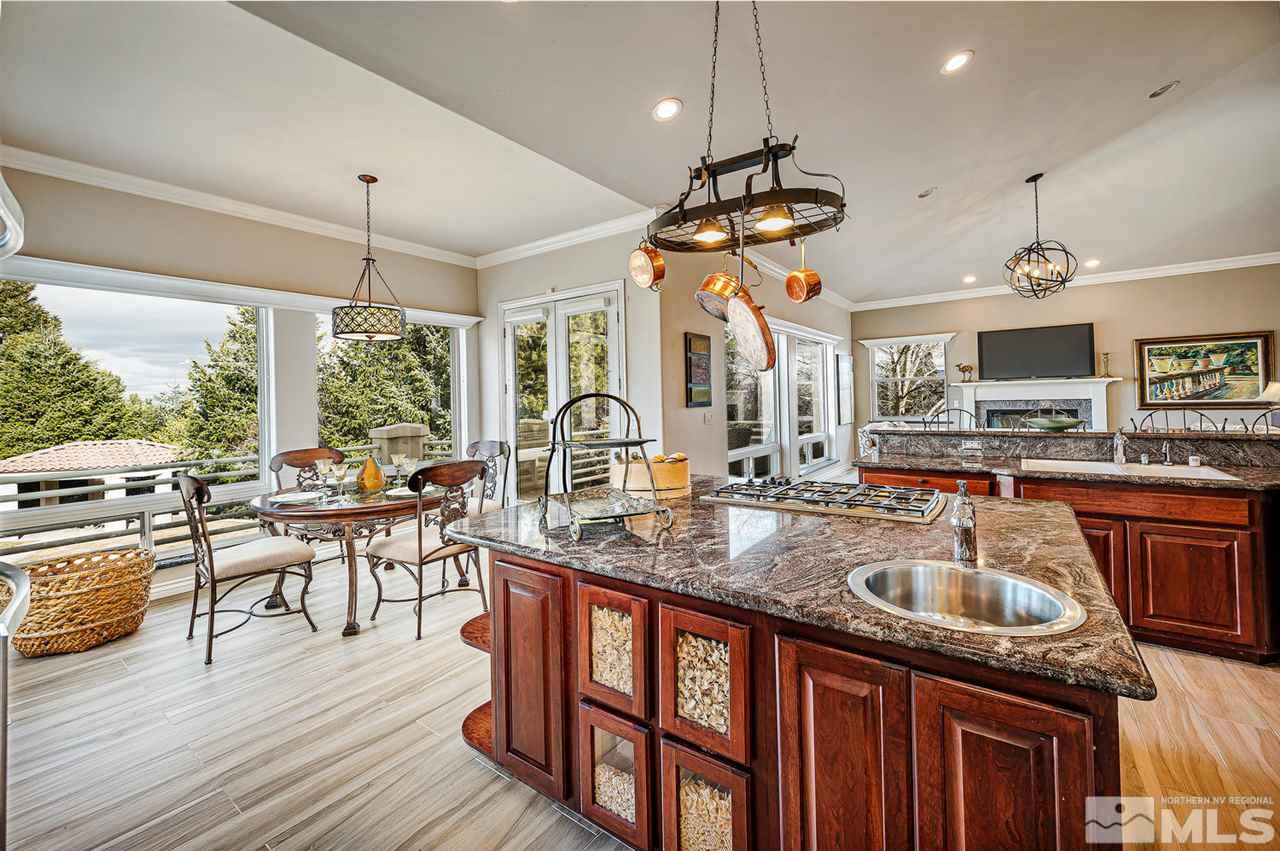 1585 Star Way Reno, NV 89511 - Photo 7 of 25 a kitchen with granite countertop a sink appliances and living room view