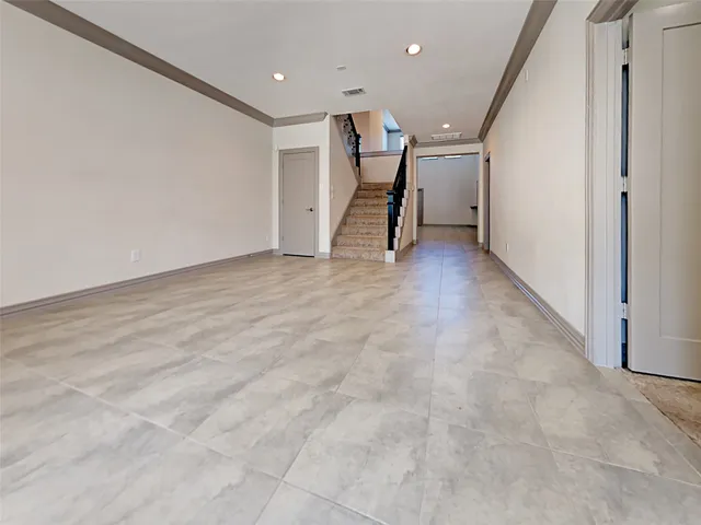 a view of a hall with stairs