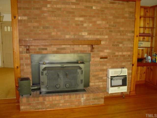 4141 Laurel Hills Road Raleigh, NC 27612 - Photo 5 of 10 a view of a fireplace