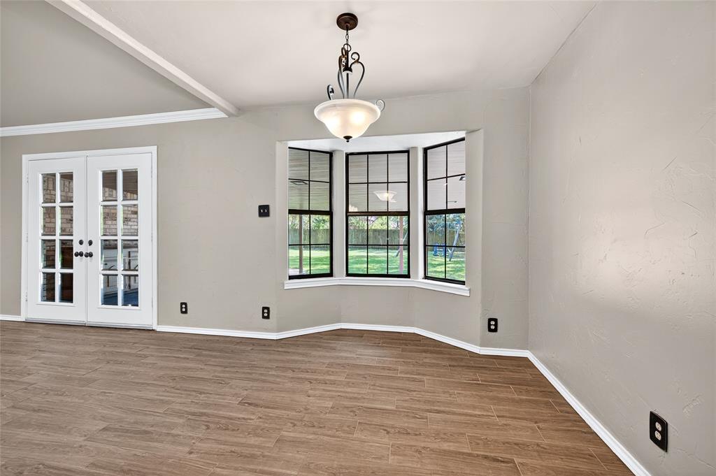 1610 Idlewood Drive Sherman, TX 75092 - Photo 15 of 31 a view of an empty room with wooden floor and a window