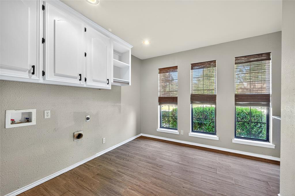 1610 Idlewood Drive Sherman, TX 75092 - Photo 16 of 31 a view of an empty room with wooden floor and a window