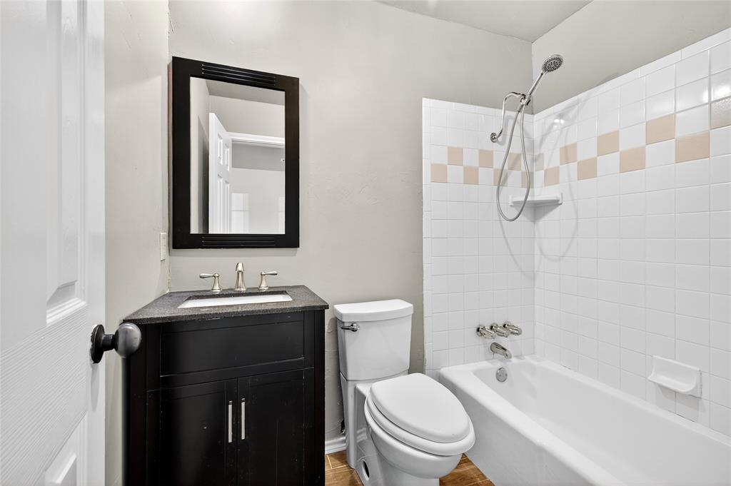 1610 Idlewood Drive Sherman, TX 75092 - Photo 18 of 31 a bathroom with a sink a toilet and shower