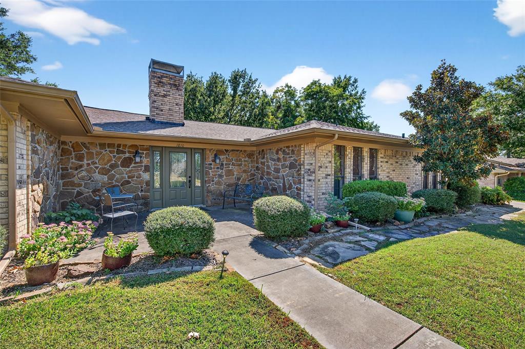 1610 Idlewood Drive Sherman, TX 75092 - Photo 4 of 31 a front view of a house with garden
