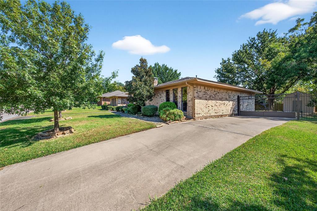 1610 Idlewood Drive Sherman, TX 75092 - Photo 5 of 31 a front view of a house with yard and green space