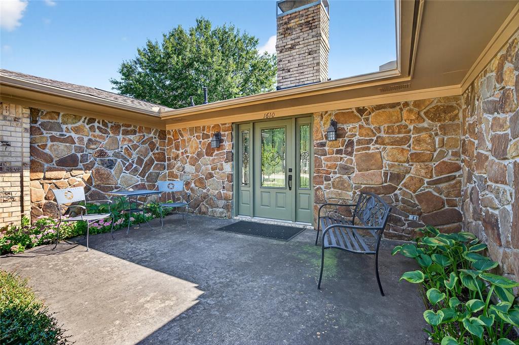 1610 Idlewood Drive Sherman, TX 75092 - Photo 6 of 31 a view of a chair and table in backyard of the house