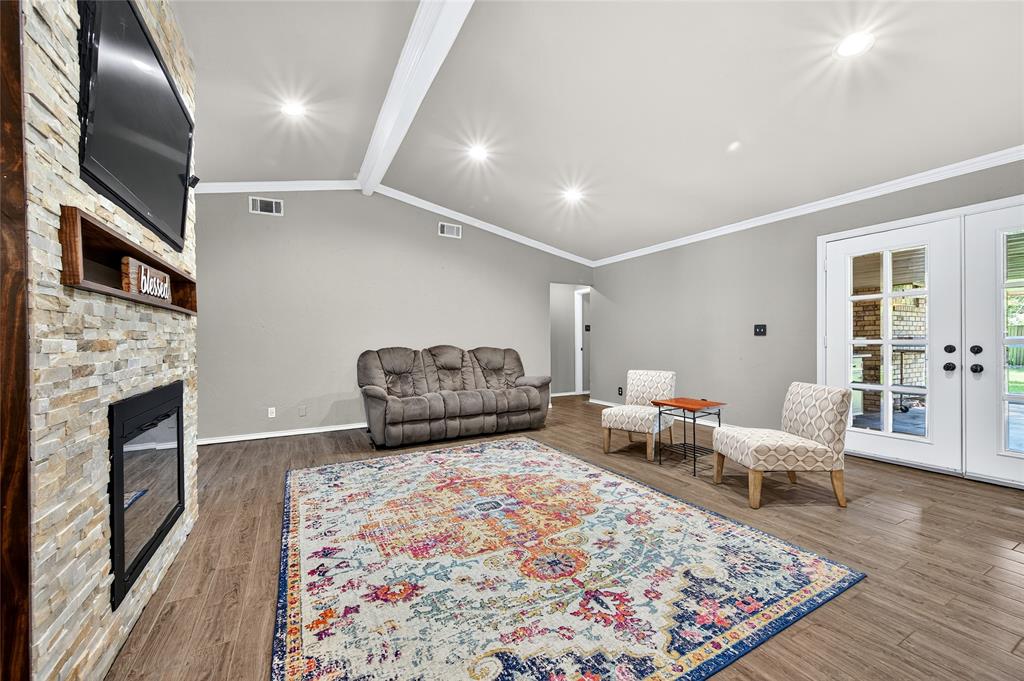 1610 Idlewood Drive Sherman, TX 75092 - Photo 10 of 31 a living room with furniture and a fireplace