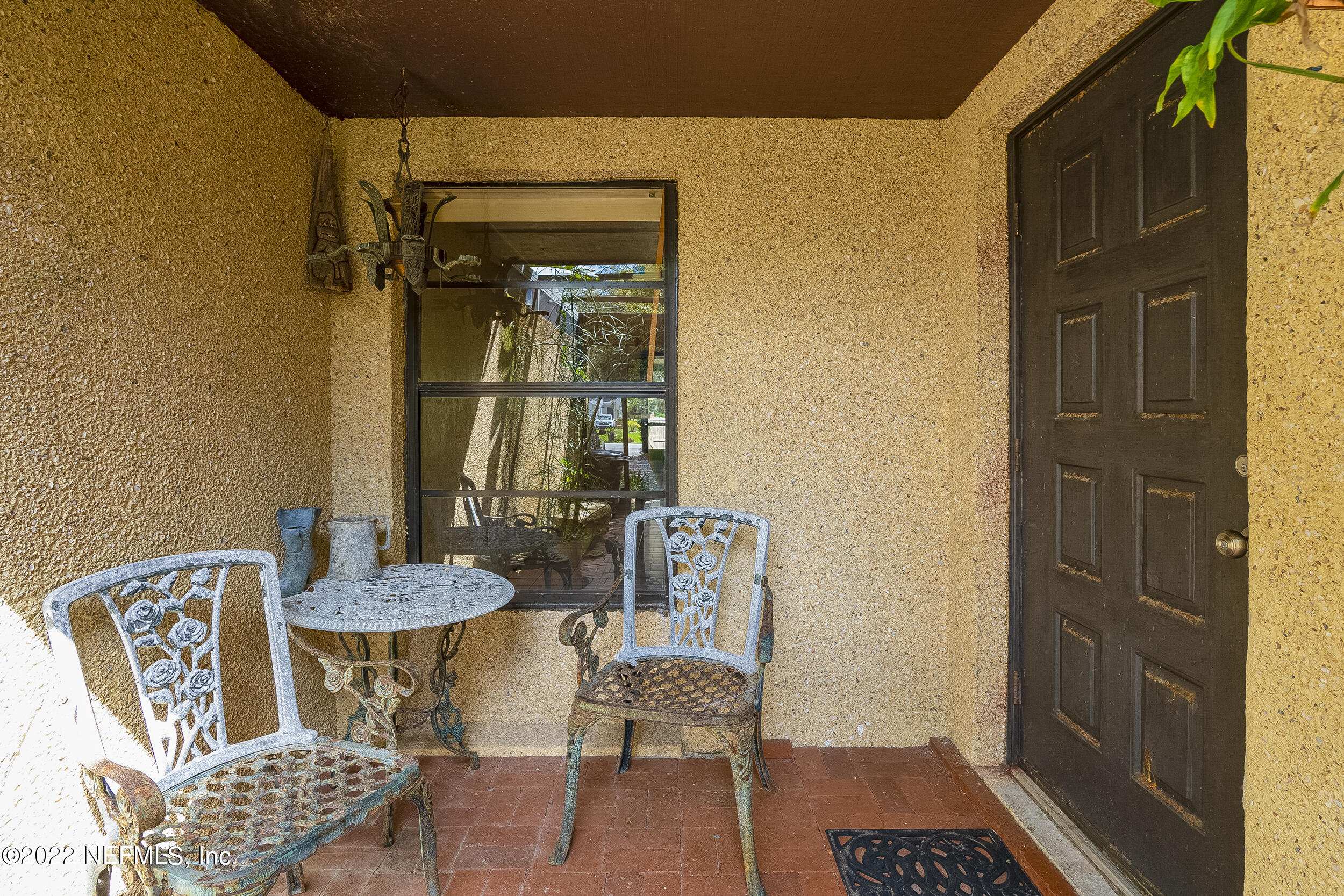 3403 Sanddollar Court St. Augustine, FL 32084 - Photo 16 of 47 a balcony with furniture and a potted plant