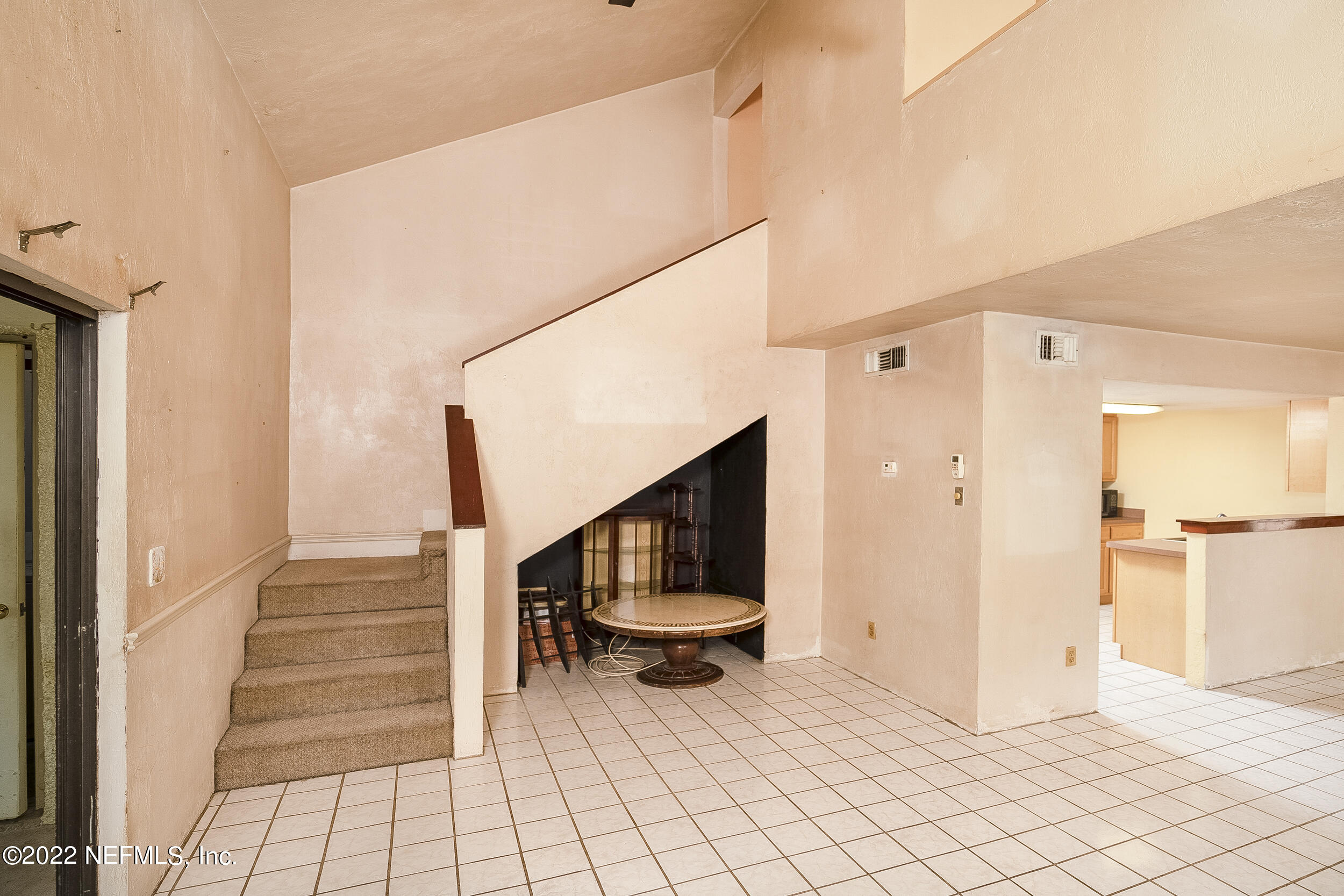 3403 Sanddollar Court St. Augustine, FL 32084 - Photo 23 of 47 a view of an entryway with wooden floor and dining room