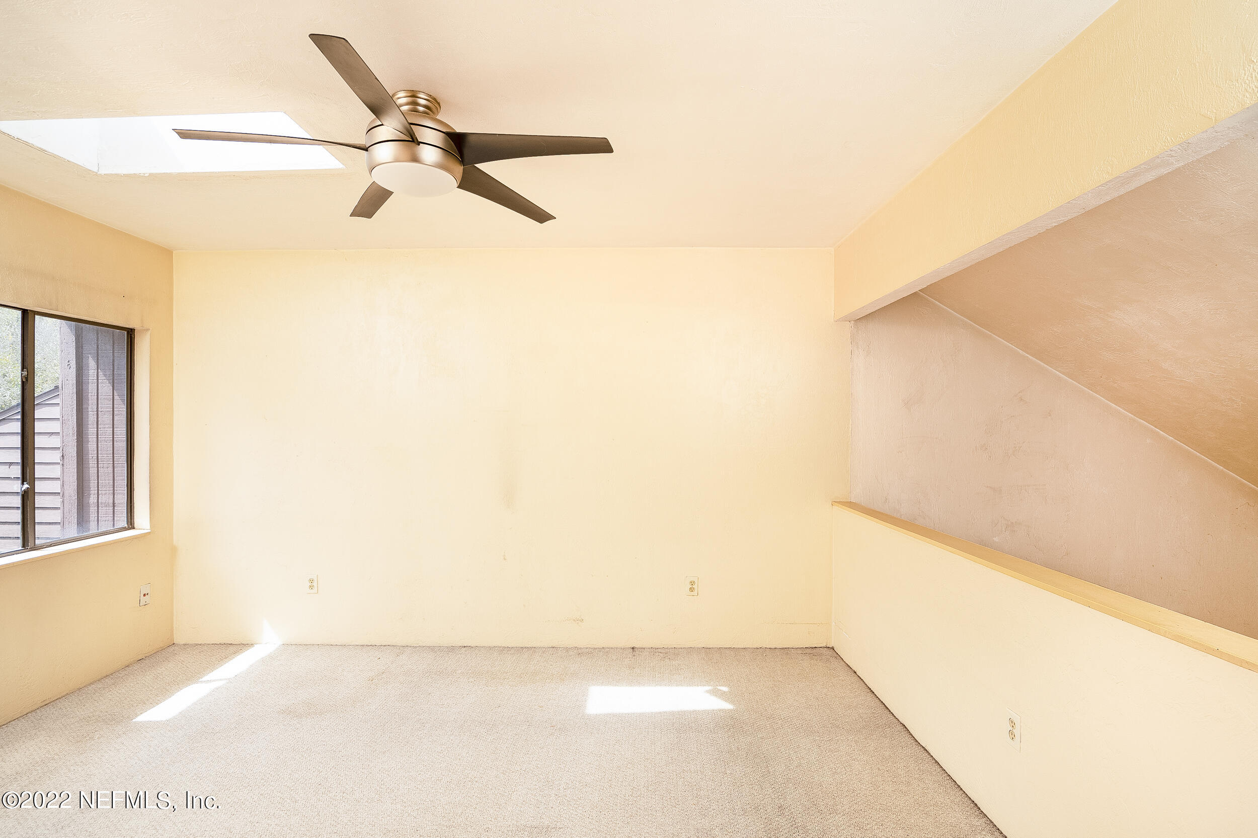 3403 Sanddollar Court St. Augustine, FL 32084 - Photo 34 of 47 a view of a room with a ceiling fan and a window