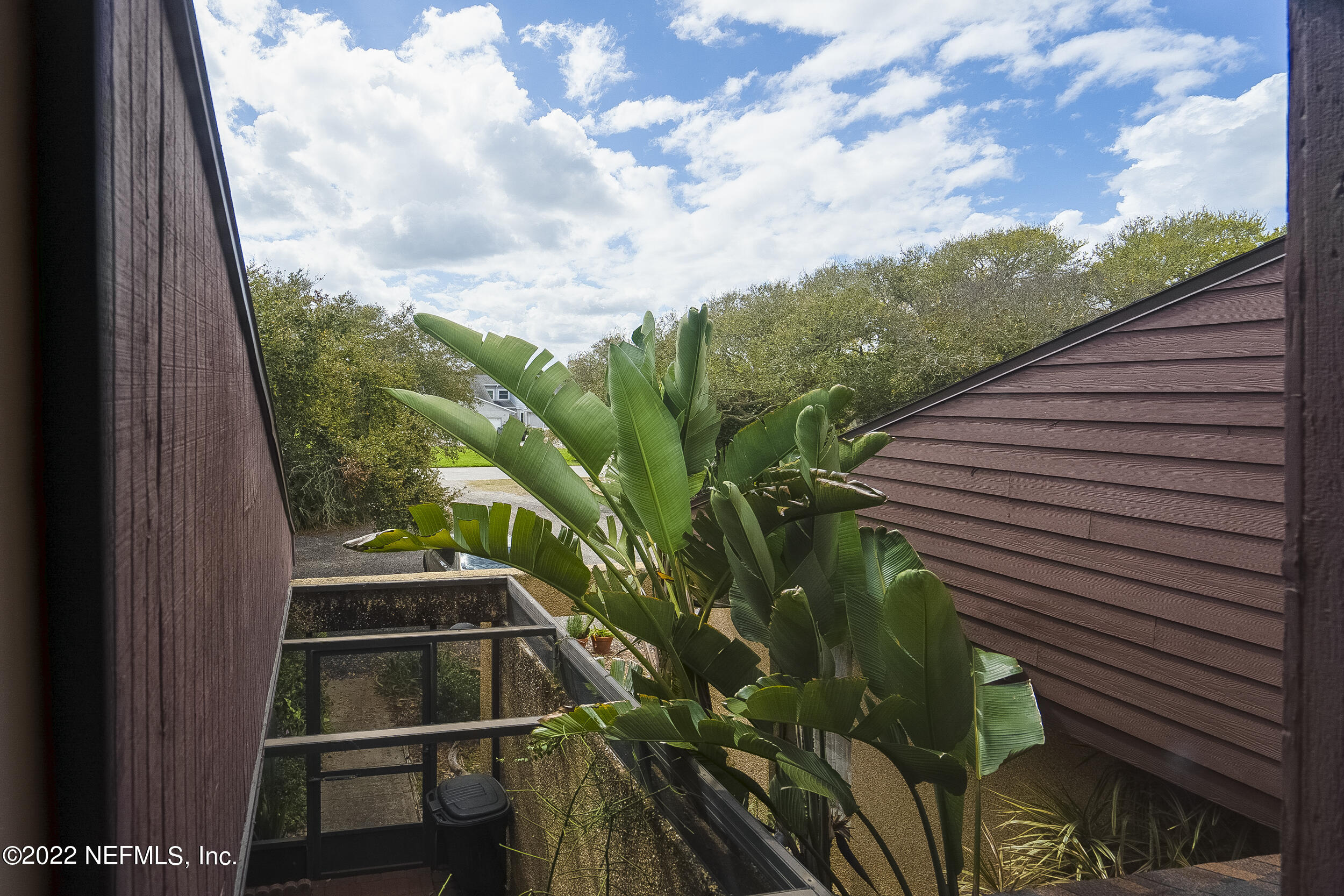 3403 Sanddollar Court St. Augustine, FL 32084 - Photo 35 of 47 a backyard of a house with table and chairs