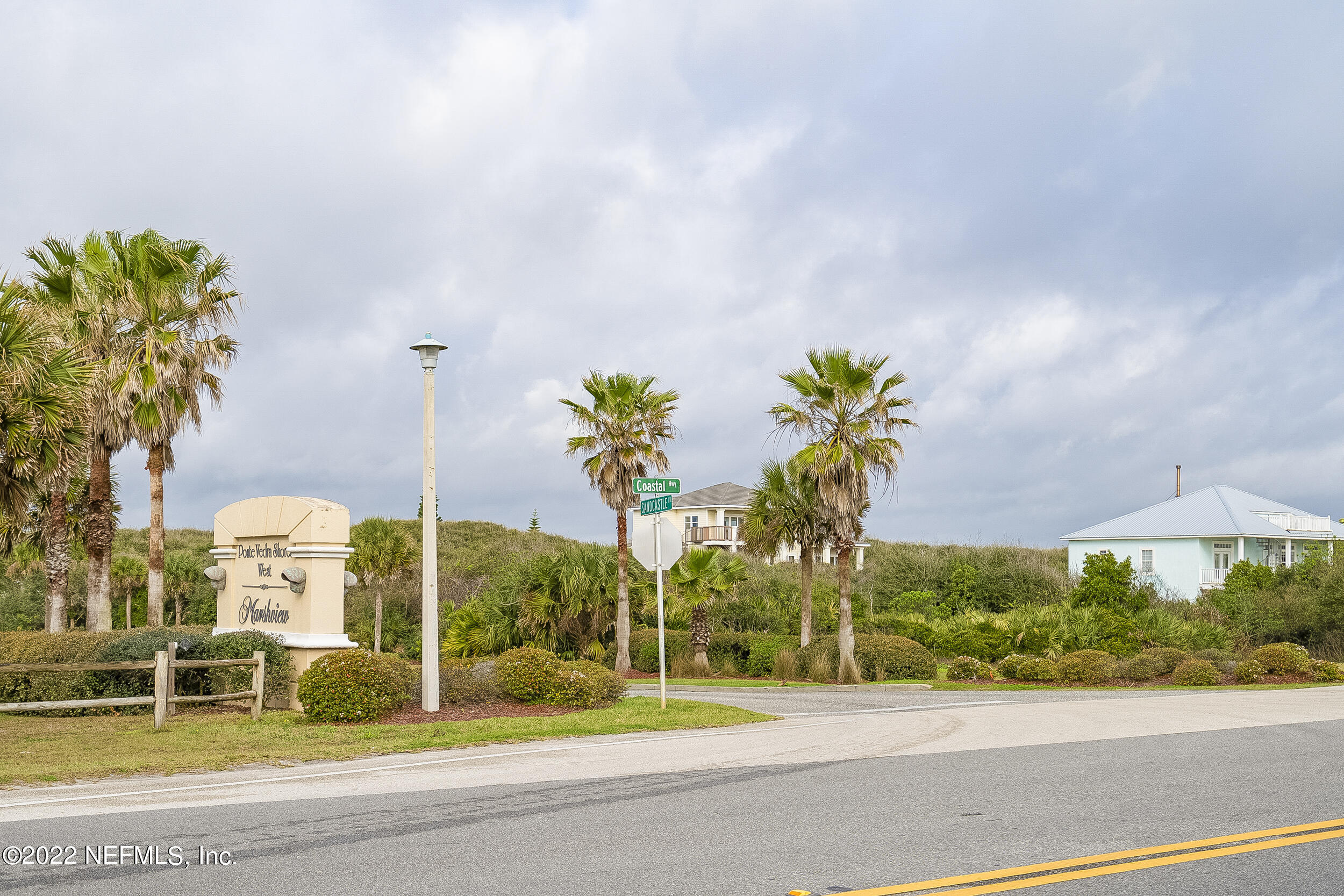 3403 Sanddollar Court St. Augustine, FL 32084 - Photo 41 of 47 a palm tree sitting in front of a building