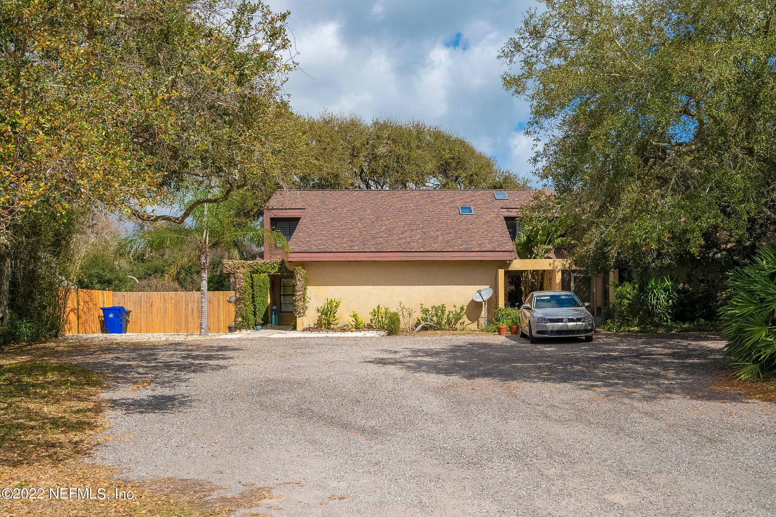 3403 Sanddollar Court St. Augustine, FL 32084 - Photo 9 of 47 a front view of a house with a yard and garage