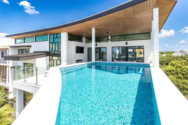 a view of a workspace with furniture and window