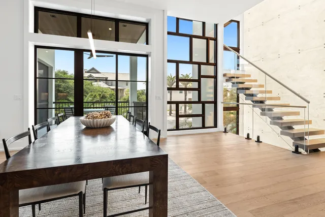 a living room with a bed furniture and a flat tv screen