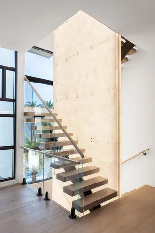 a large white bed in a white room