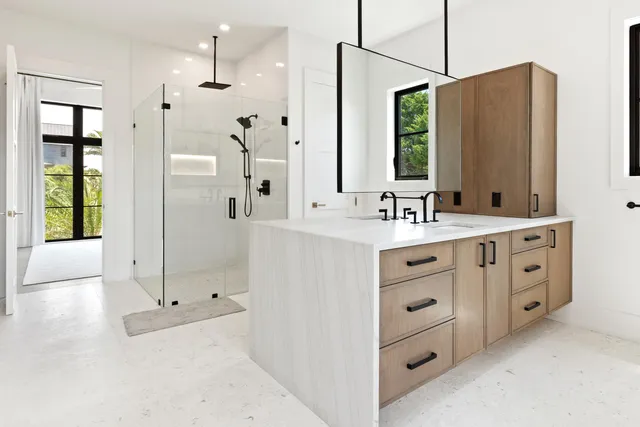 a bedroom with a large bed and a flat screen tv