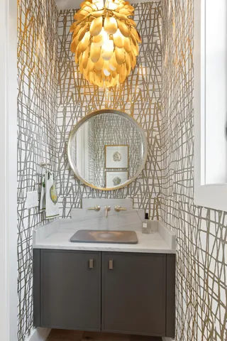 a bathroom with a sink vanity and a mirror
