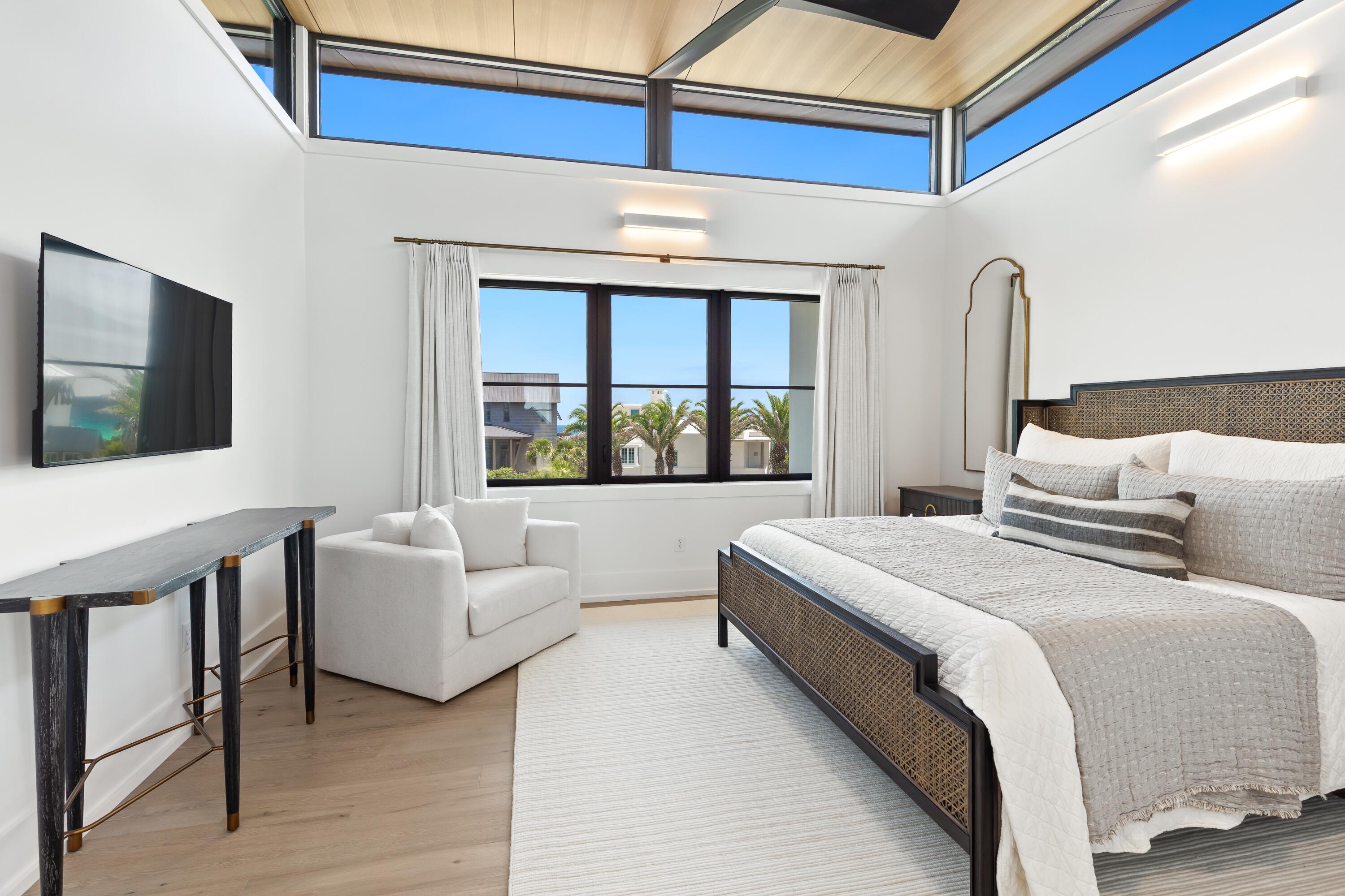 33 Camp Creek Point Dr Inlet Beach Inlet Beach, FL 32461 - Photo 68 of 110 a bedroom with a balcony a bed and a flat screen tv