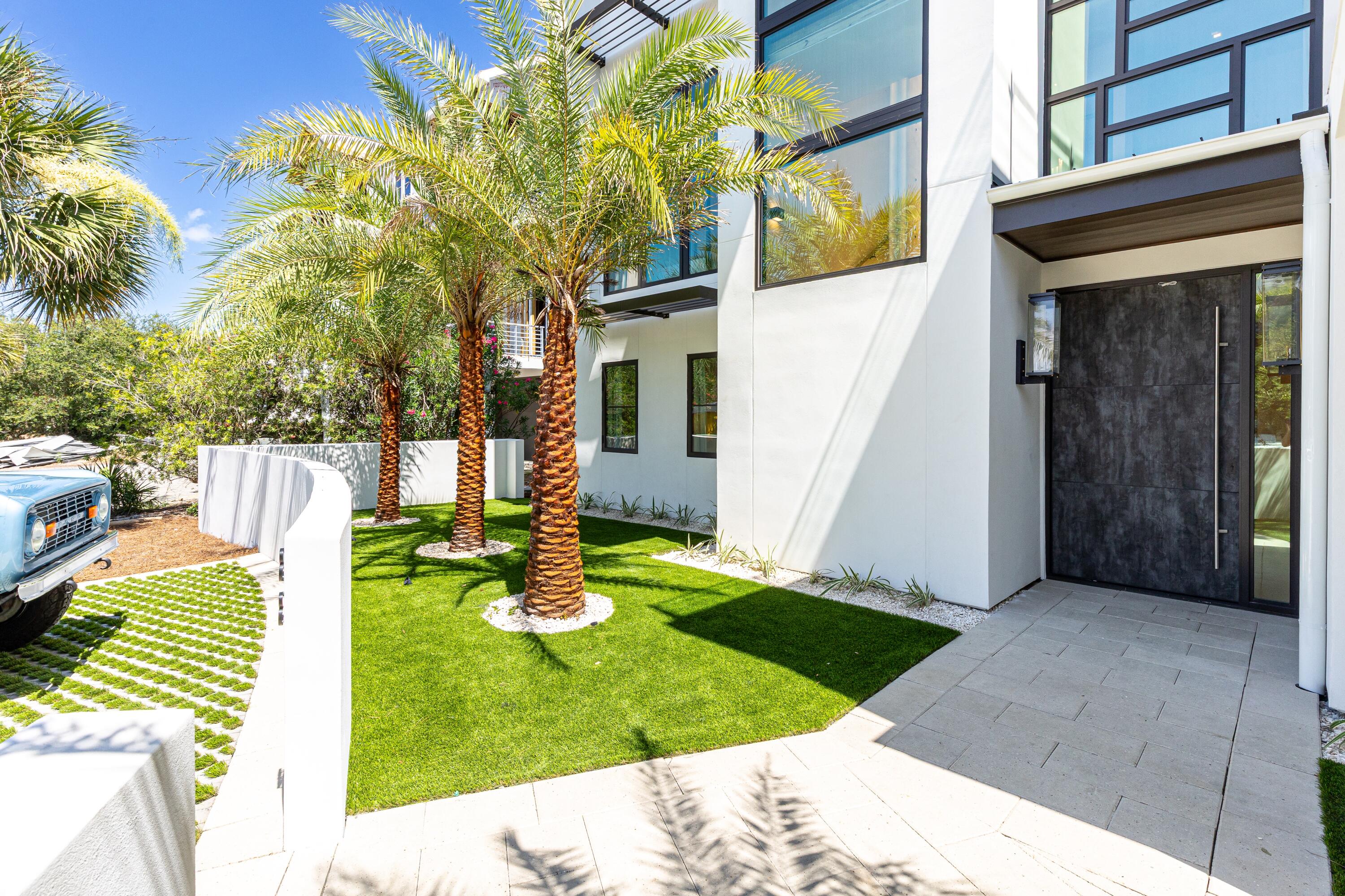 33 Camp Creek Point Dr Inlet Beach Inlet Beach, FL 32461 - Photo 7 of 110 a view of a white house with a small yard and potted plants