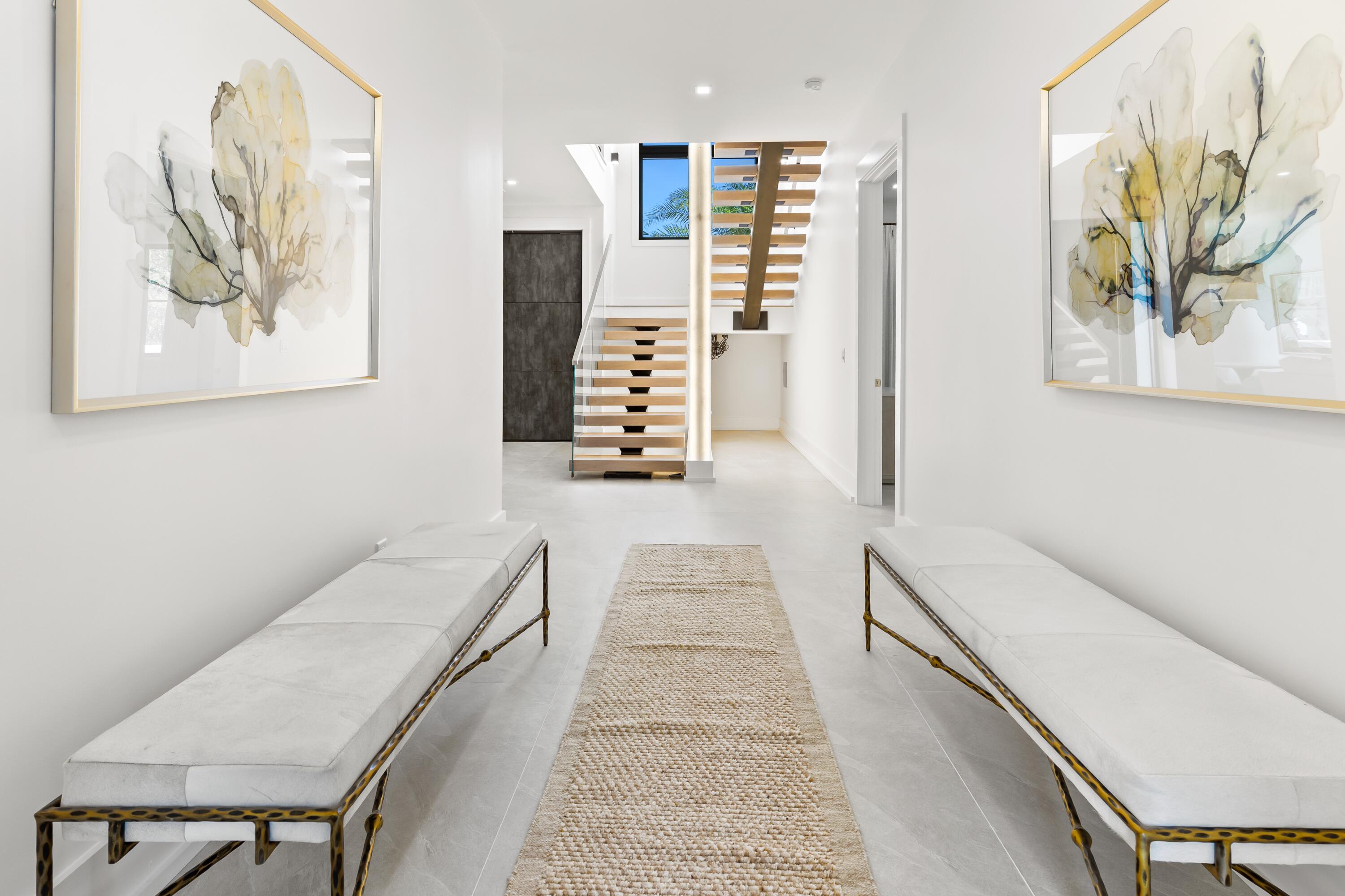 33 Camp Creek Point Dr Inlet Beach Inlet Beach, FL 32461 - Photo 81 of 110 a hallway with a large mirror and a couch