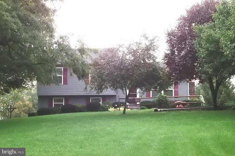 4297 Bark Hill Road Union Bridge, MD 21791 - Photo 1 of 16 a view of a house with a back yard