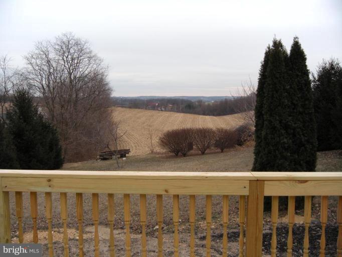 4297 Bark Hill Road Union Bridge, MD 21791 - Photo 6 of 16 a view of a balcony with wooden fence