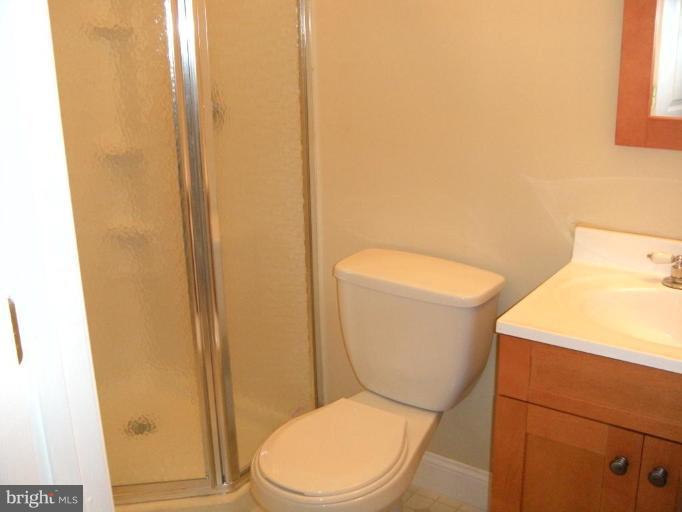 4297 Bark Hill Road Union Bridge, MD 21791 - Photo 9 of 16 a white toilet sitting next to a sink
