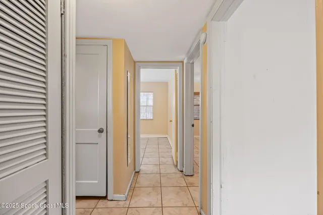 a view of a hallway with a bathroom
