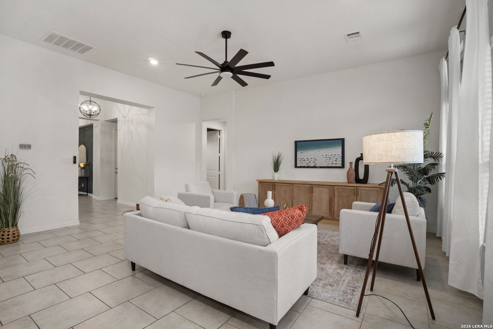 32134 Mirasol Bend Bulverde, TX 78163 - Photo 12 of 44 a living room with furniture and a flat screen tv
