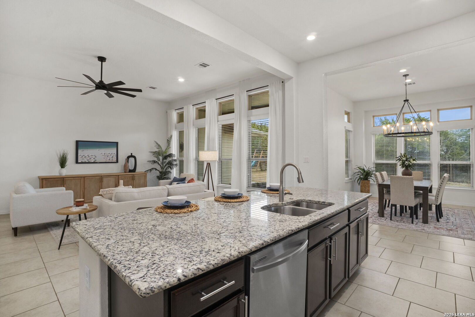 32134 Mirasol Bend Bulverde, TX 78163 - Photo 18 of 44 a kitchen with granite countertop a sink and a stove