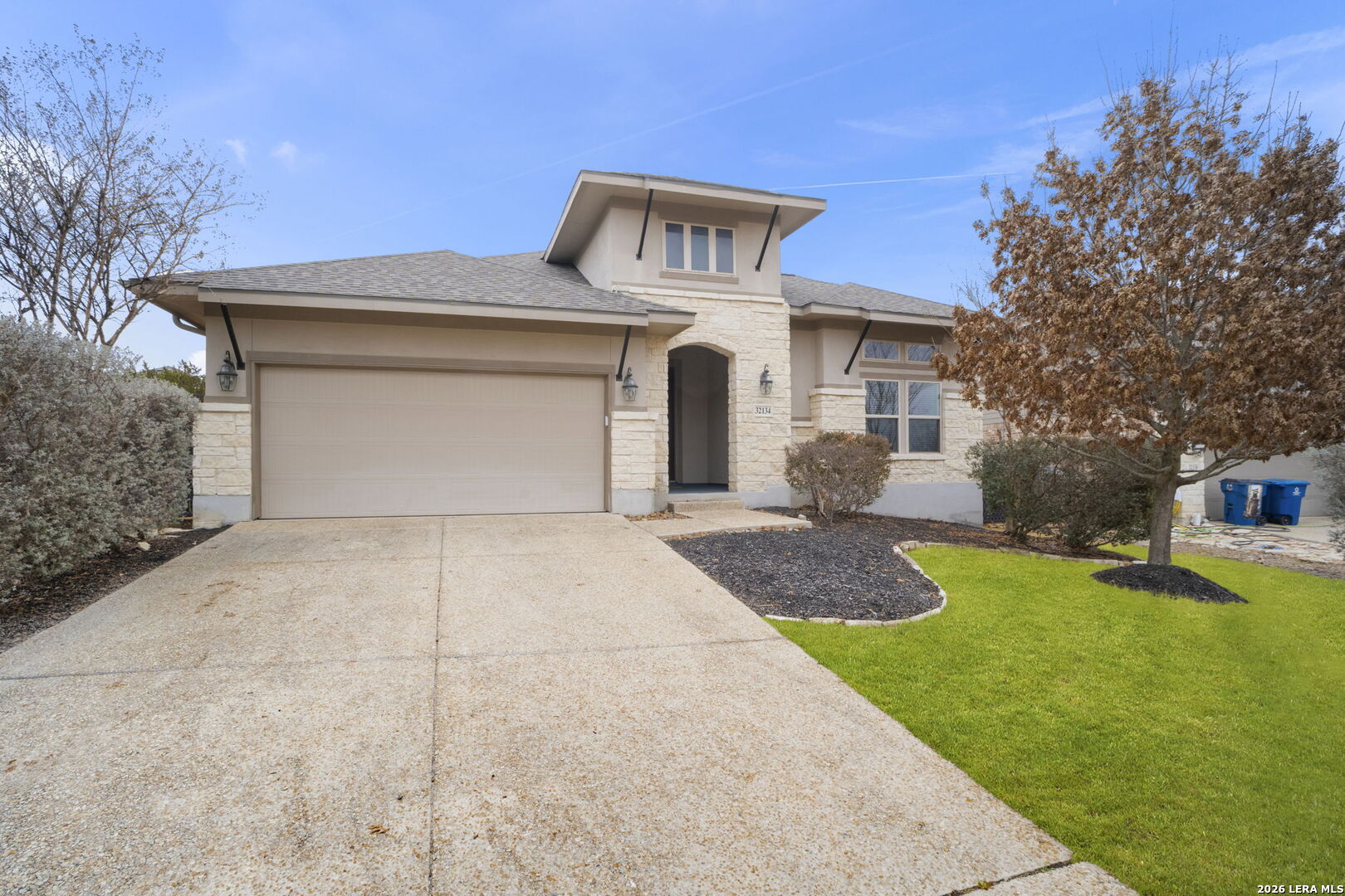 32134 Mirasol Bend Bulverde, TX 78163 - Photo 3 of 44 a front view of a house with garden