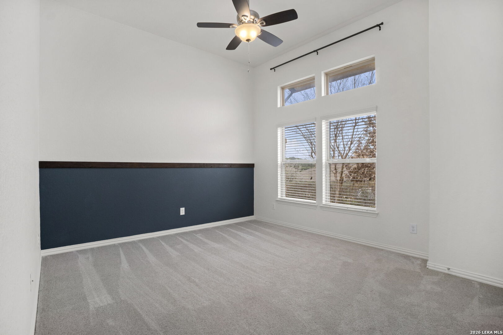 32134 Mirasol Bend Bulverde, TX 78163 - Photo 31 of 44 an empty room with windows and fan