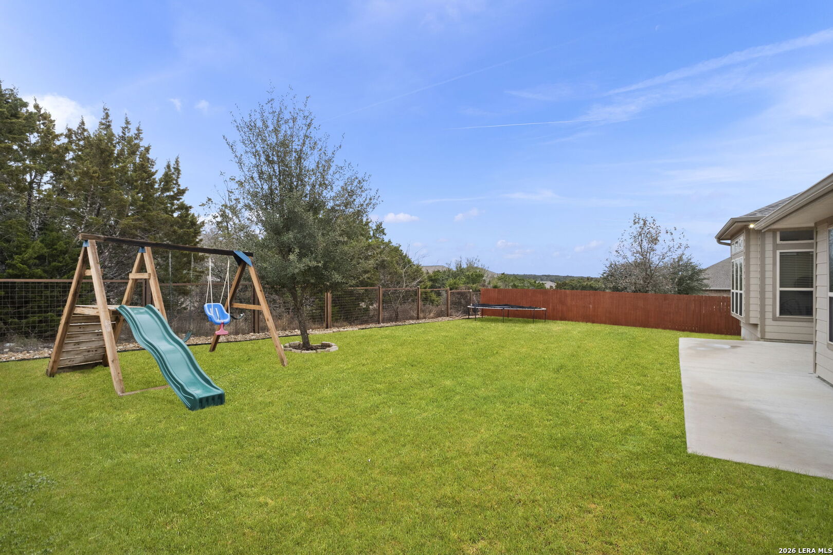 32134 Mirasol Bend Bulverde, TX 78163 - Photo 39 of 44 a view of a backyard with a slide
