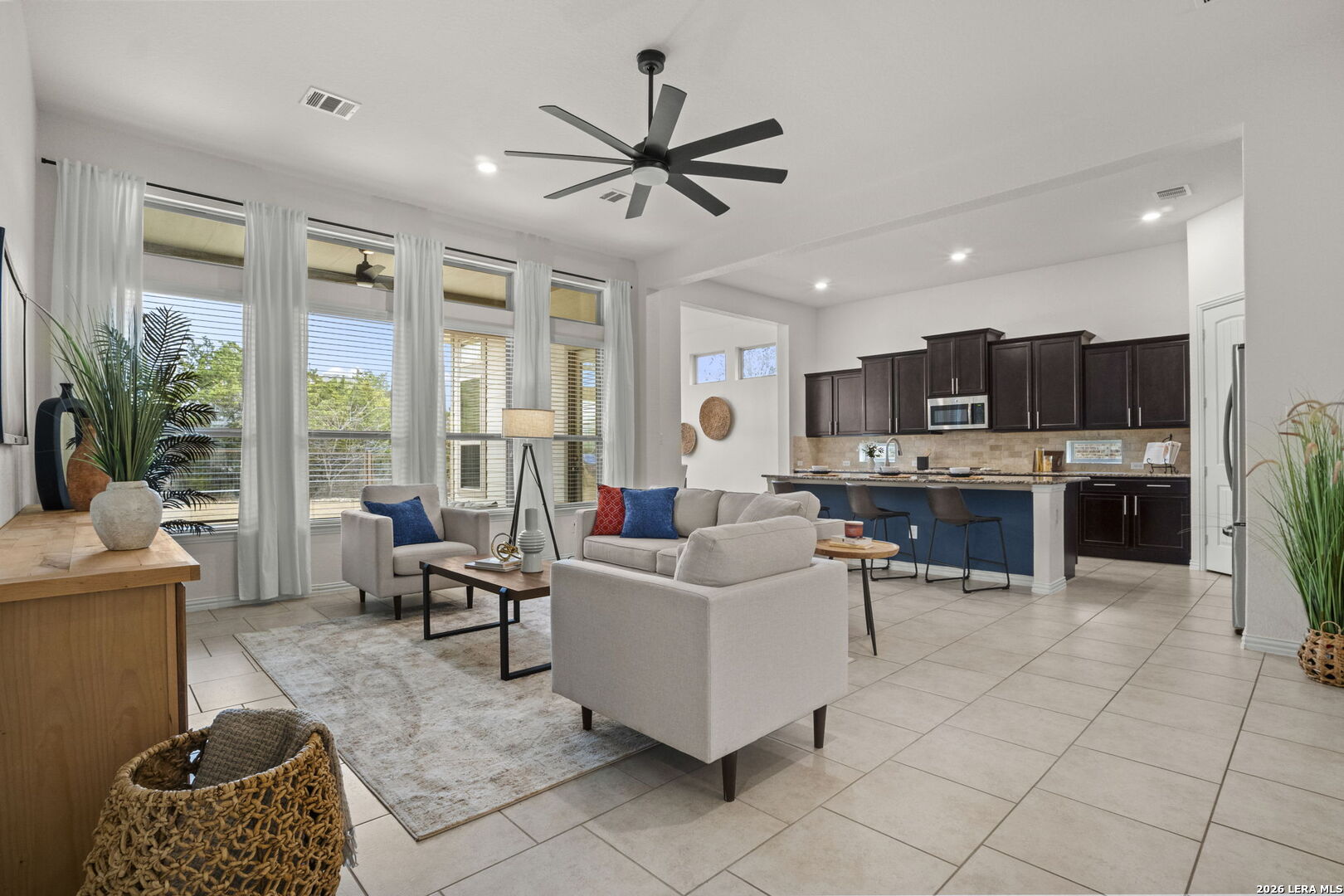 32134 Mirasol Bend Bulverde, TX 78163 - Photo 8 of 44 a living room with furniture and kitchen view