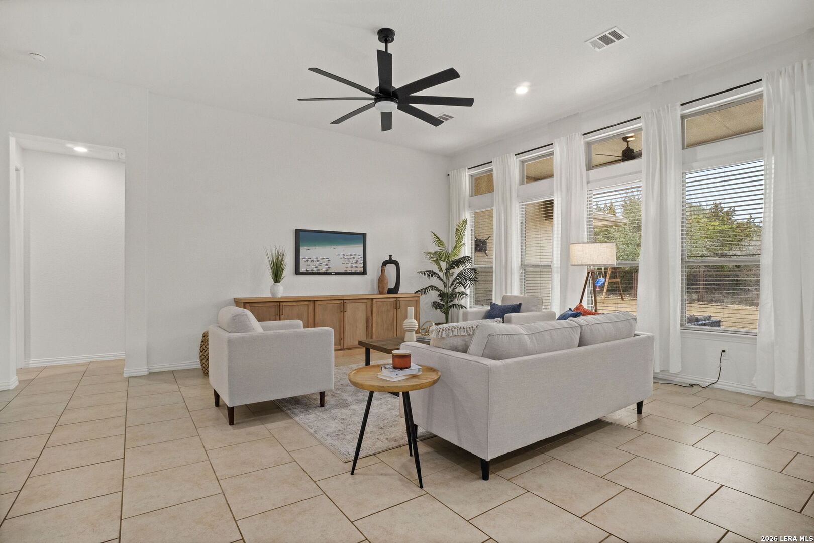 32134 Mirasol Bend Bulverde, TX 78163 - Photo 9 of 44 a living room with furniture and a large window