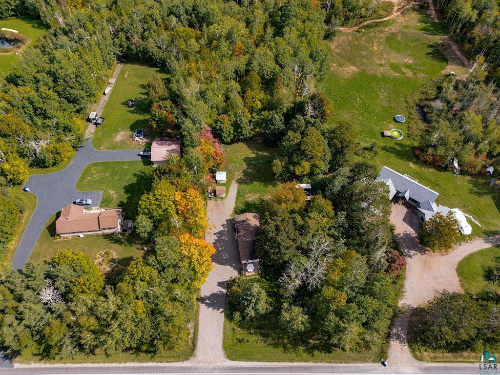 5466 Jean Duluth Road Duluth, MN 55803 - Photo 32 of 34 Expansive property featuring multiple structures, mature trees, a pond, and direct road access
