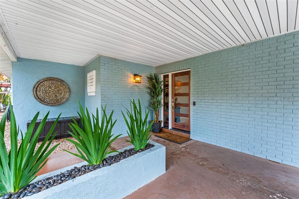 29 Pelican Lane Edgewater, FL 32141 - Photo 2 of 39 a front view of a house with garden