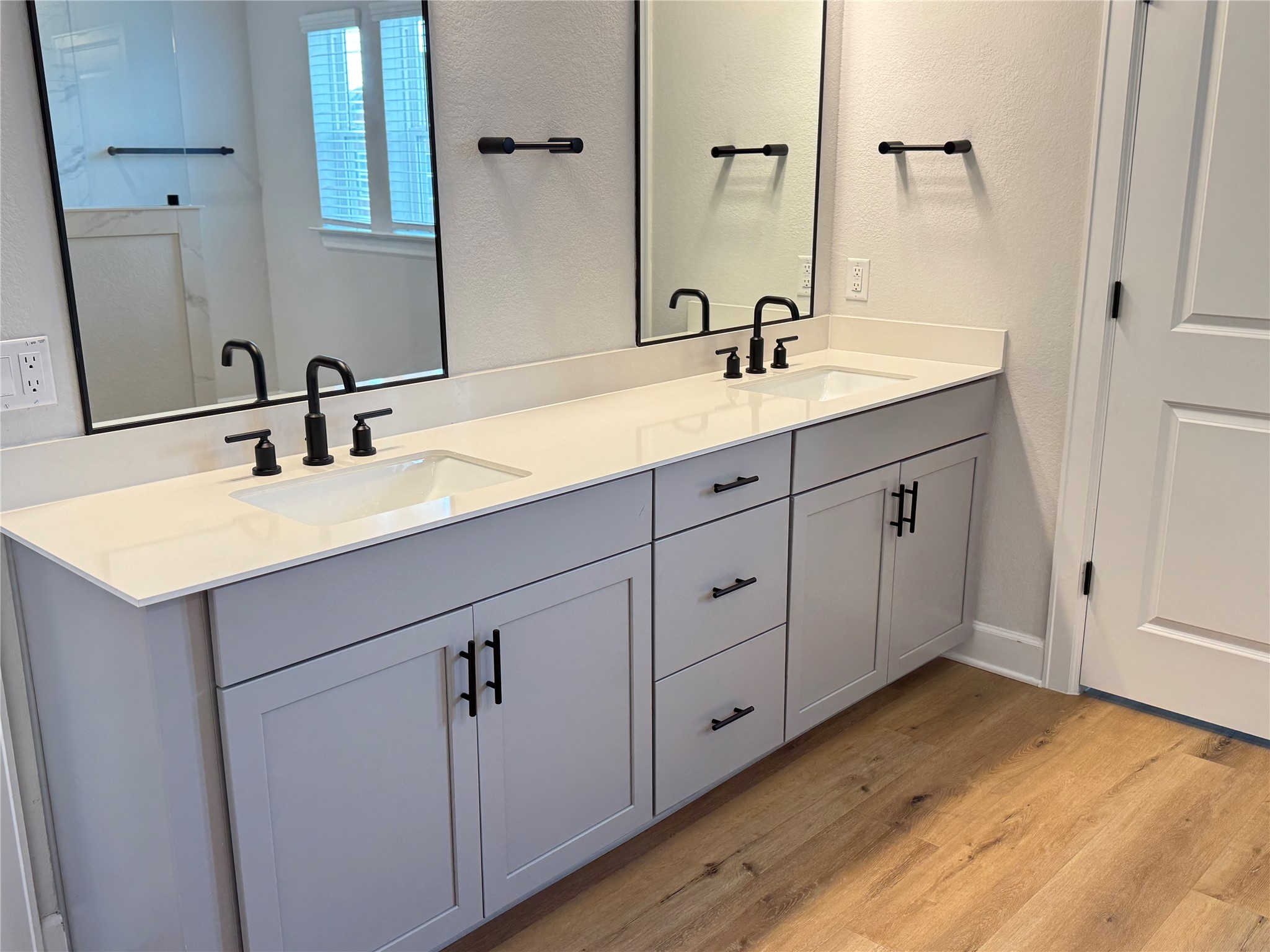 3000 Chisholm Trail Road, Unit 63 Round Rock, TX 78681 - Photo 17 of 31 Bathroom with double vanity, a sink, and wood finished floors
